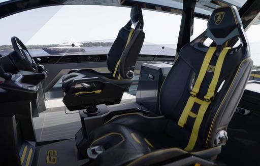 The Tecnomar Lamborghini 63 helm seats features black and yellow detailing, in addition to bright yellow racing harnesses for additional safety