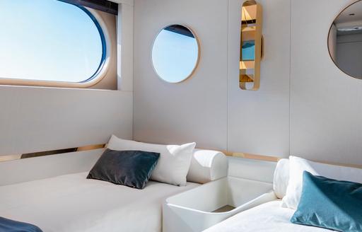 Twin cabin onboard Magellano 25 Metri, two single beds with wide window