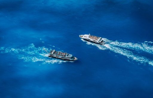 two passenger vessels passing port to port keeping clear