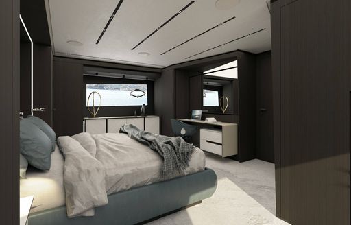 Master cabin onboard Pershing GTX116, central berth facing a dressing table with a window in background.