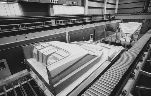 Aerial view of Ferretti 1000 in construction inside shipyard facility