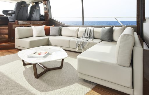 The contemporary lounging area on board a Princess V78 superyacht