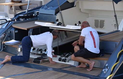 people looking at the yacht engine