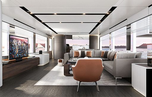 L-shaped, grey sofa faces a flat-screen TV in the main salon of Astondoa AS8 yacht