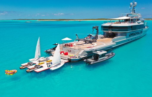 Helipad and watersports equipment with superyacht BOLD. Surrounded by azure waters.