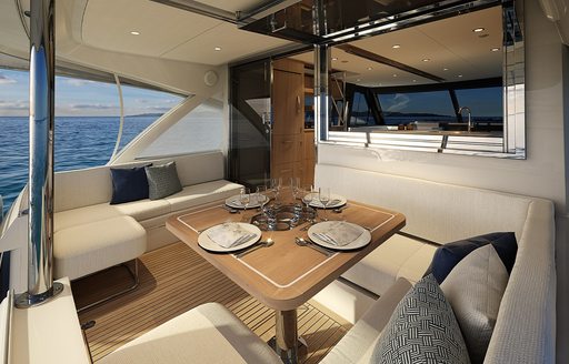 Riviera 58 sports motor yacht aft cockpit dining configuration