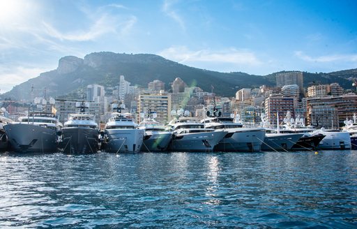 motor yachts lined up in marina in Monaco