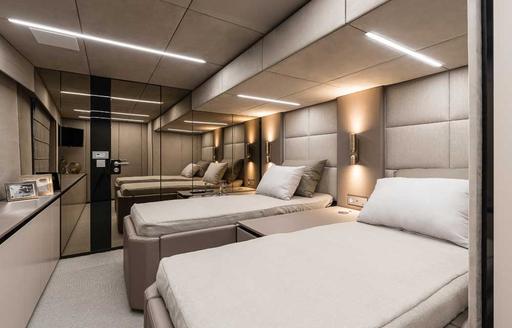 Two beds inside 80 Sunreef Power cabin with soft lighting 