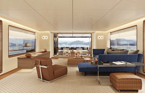 Rendering of navy blue sofa, brown armchair, white rug and large windows in the main salon of the Navetta 30 yacht 