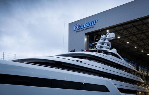 Feadship PRoject 816 emerging from fitting shed 