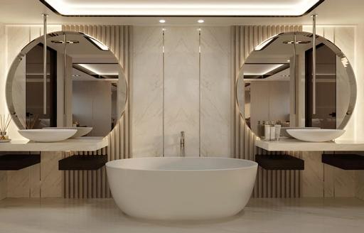 Elegant marble bathroom showing sink and mirrors