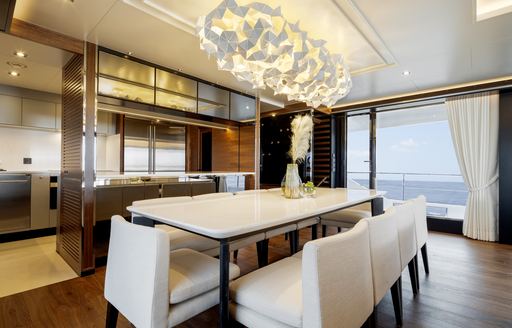 Formal dining area on FD87 with chandelier above table