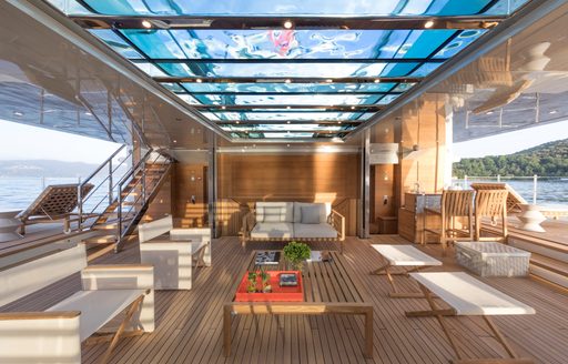 Beach club with transparent pool above on 52Steel superyacht