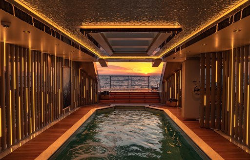 Night view of inside pool on superyacht TATIANA