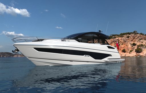 Sunseeker Predator 55 for sale at FLIBS, water level image to port side bow, yacht still in calm waters