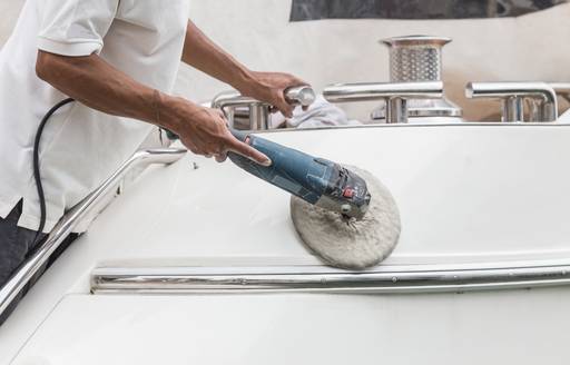 person cleaning the yacht