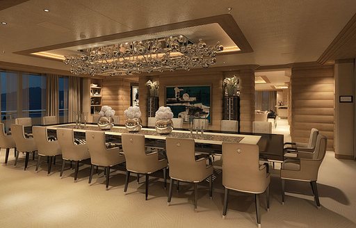 Dining area of LANA superyacht by Benetti. Twenty seats around long rectangular table is luxurious dining area.