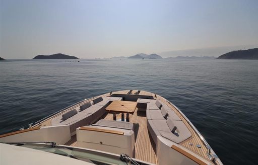 foredeck on yacht from mcy 86 series, with lounging area and sea surrounding