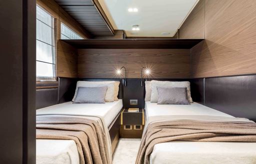 Twin cabins on a Ferretti 670 yacht