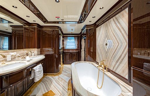 En-suite bathroom onboard Sanlorenzo Lady Lena, bath on starboard side with his and hers sinks port