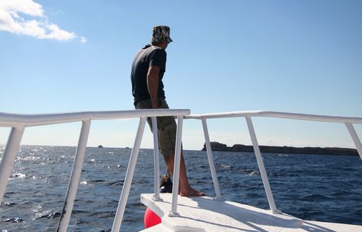 man on yacht bow