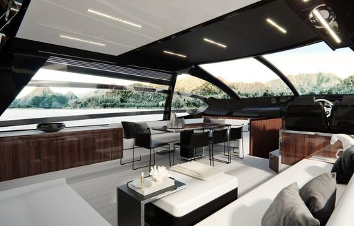 Sofas and tables in airy interior of Riva 76 Super Perseo