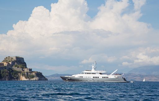 superyacht with grey hull on anchor