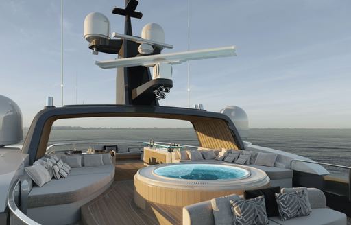 Sun deck onboard Project Rinascimento, central Jacuzzi with sunpad seating to either side, surrounded by sea at dusk