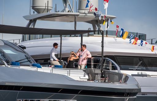 charter brokers on deck of superyacht