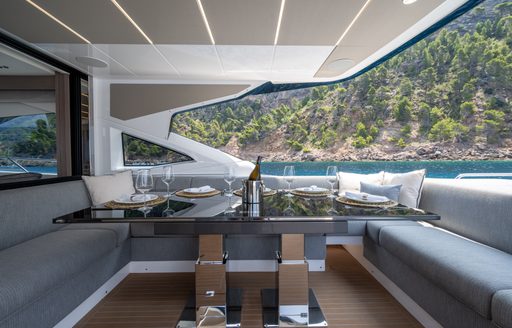 Exterior dining option onboard the Sunseeker 75 Sport Yacht 