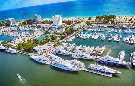 Aerial view of Lauderdale Marina – Fort Lauderdale. Many yachts moored, surrounded by sea.