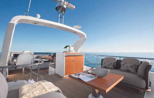 the upper deck of a flybridge yacht