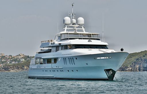 yacht on anchor displaying anchor ball