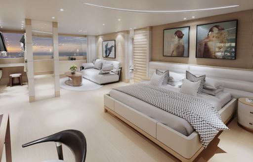 Master cabin onboard Benetti B.YOND 37m. Central berth adjacent to sofa with paintings on the wall behind.