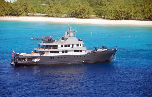 explorer yacht with helicopter, on anchor