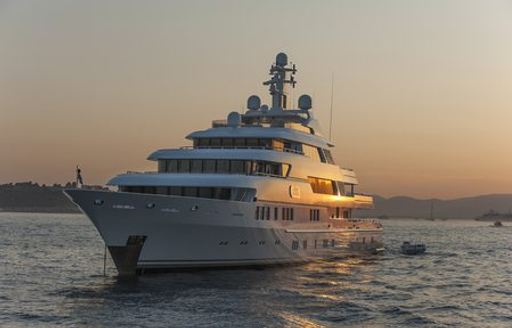 yacht on anchor at sunset