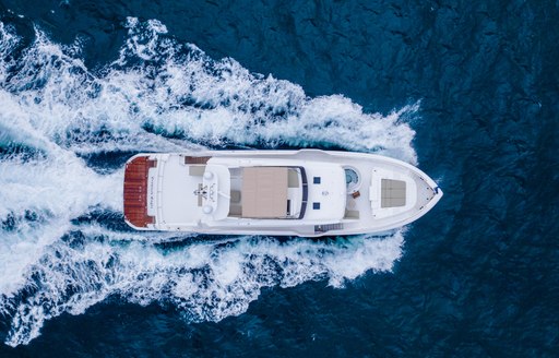 Aerial view of Horizon FD92 tri-deck underway, surrounded by sea