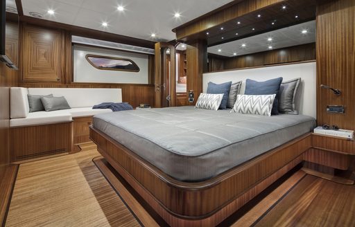 Large double bed in cabin on superyacht ALECTO