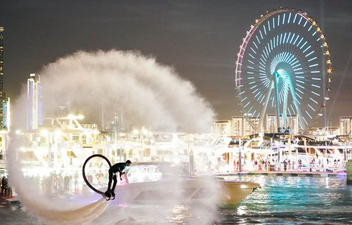 Dubai International Boat Show night image with jet fly