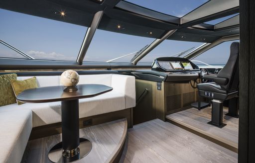 Helm station and seating area on Sunseeker 90 Ocean