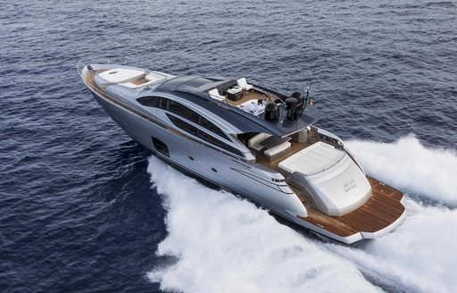 Tender boat moving at speed on sea, viewed diagonally from above