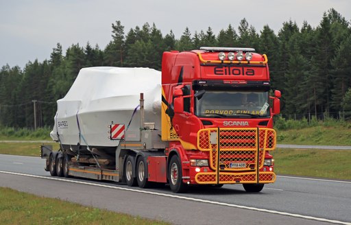 boat on back of transportation truck