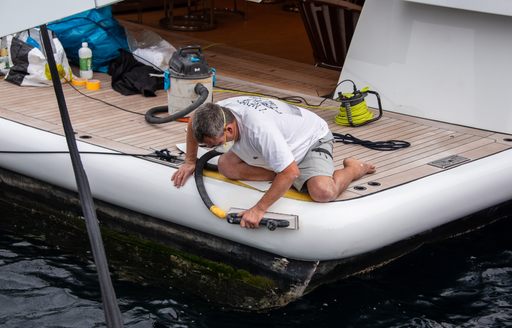 image shows yacht crew working on the bathing platform of a yacht at MYS 2024