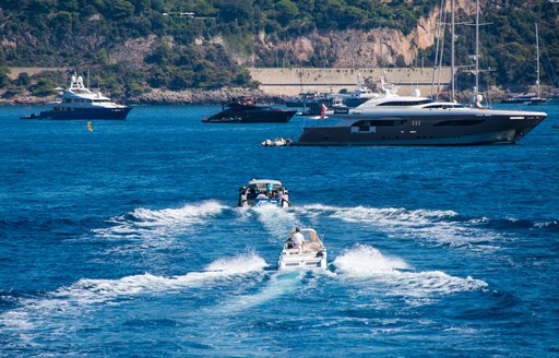 luxury shuttle tenders to superyachts on anchor in Bay of Monaco 