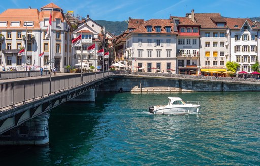 air draft boat passing under bridge