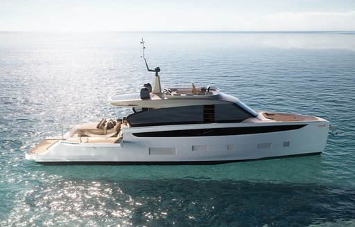 Azimut Seadeck 7 motor yacht mid aerial view over starboard side profile, stationary in calm sea on bright day