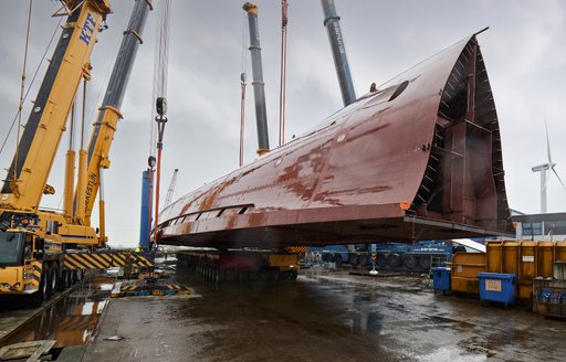 Hull of Project Sparta being turned by crane