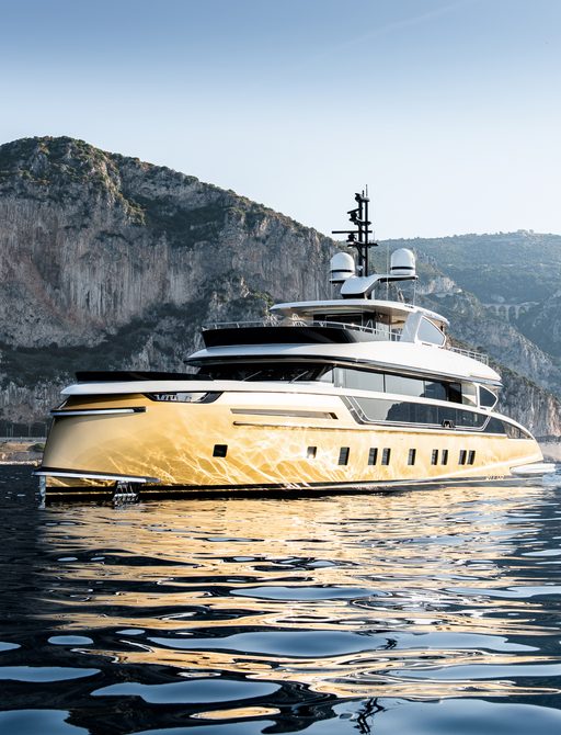 Superyacht STEFANIA on water with coast behind