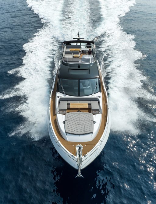 Forward view of the Sunseeker 75 Sport Yacht underway, looking directly at the bow with sunpads.