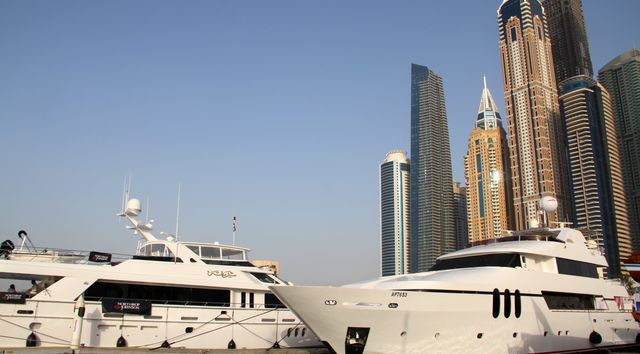 Yachts in front of skyscrapers at Dubai International Boat Show